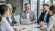 © NewFresh  - Group of business people working together at meeting in modern office. Businessmen and businesswomen working together on laptop computer.