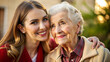 © NewFresh  - Portrait of happy senior woman with adult daughter embracing and looking at camera