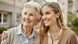 © NewFresh  - Portrait of happy senior woman with adult daughter embracing and looking at camera