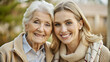 © NewFresh  - Portrait of smiling senior woman with her adult daughter in the park