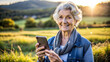 © NewFresh  - Portrait of a smiling senior woman using mobile phone in the countryside