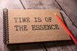 © Uladzislau - Closeup on businessman holding a card with TIME IS OF THE ESSENCE message