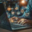 © Chatchanan - Online Shopping concept. Businessman use laptop with virtual screen of online shopping icon. Explore a seamless online shopping service with convenient home delivery options.