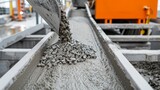 Detailed view of concrete processing machinery, highlighting the commercial production line, mixing and pouring operations in an industrial setting