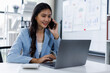 © David - Happy asian business woman working on laptop, using mobile phone at modern office, analyzing business document with financial graph, market report on digital tablet, business data analysis concept