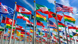 © Adisorn - Colorful flags of various countries from around the world wave gently in the breeze, densely packed on a white background, creating a vibrant and patriotic display.