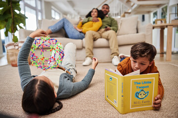 Sticker - Home, parents and kids on carpet, relax and playing games for weekend break, comfort and calm. Reading book, family and mother with father, childhood development and toys with fun, peace and people