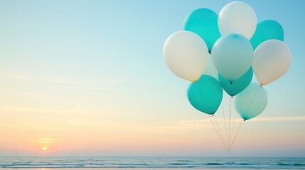 Wall Mural - Balloons floating over beach at sunset.