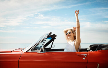 Driver, road trip and woman in car with travel for adventure, summer vacation or sightseeing. Outdoor, holiday and female person with sunglasses for transportation, destination or explore in Florida