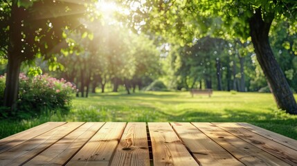 blank wooden table on green summer park background banner