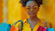 © Tanicsean - Stylish woman with curly hair, yellow glasses, and colorful shopping bags. Bright yellow background emphasizes her chic outfit and vibrant energy