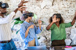 © Lomb - Diverse team exploring virtual reality: Innovation and technology in modern workspace