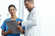 © ReeseArcurs/peopleimages.com - Feedback, medical or tablet with doctor and nurse in hospital for collaboration, diagnosis or discussion. Consulting, healthcare or review with professional medicine people in clinic for research