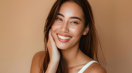 Wall Mural - A woman with long brown hair and a white tank top is smiling and making a face. She is wearing makeup and has a light skin tone