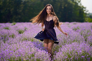 Wall Mural - Beautiful young latin woman in lavender field