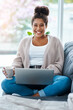 © Sanc/peopleimages.com - Woman, portrait and laptop on home sofa, freelance and blogger in apartment on couch or happy on social media. Communication, living room and smile or browsing on website, tech and internet in house