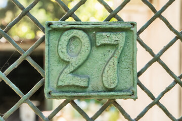 Wall Mural - Old retro weathered cast iron plate with number 27