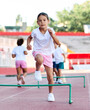 © Lumos sp - child sport athlete childhood girl competition fun young outdoor active exercise kid running fitness training athletic game healthy group play team school exercising