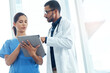 © peopleimages.com - Healthcare, medical or tablet with doctor and nurse in hospital for collaboration or discussion. Consulting, diagnosis or review with medicine professional man and woman in clinic for research