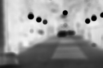 Wall Mural - a dreamy view of a sidewalk in the city in black and white film negative.