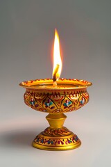 traditional diwali lamp with a bright flame, symbolizing light and positivity.