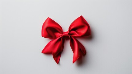 Poster - Red bow with ribbon on white background seen from above