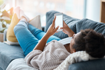 Woman, smartphone and screen or relax on sofa, messaging app and texting virtual or long distance contact. Typing, keyboard and mobile on couch, social media and living room for communication