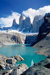 Canvas Print - Discuss the adventure of hiking the Torres del Paine Circuit in Chile, with its dramatic scenery, turquoise lakes, and towering mountain peaks.