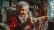 © zenith - An elderly woman is knitting a sweater while sitting on a couch