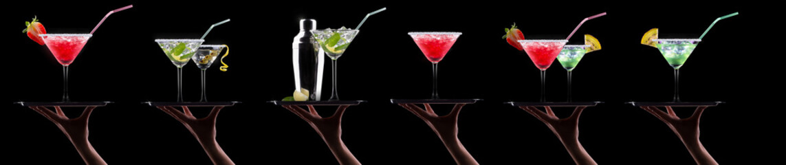 Poster - Hand holding tray with different alcohol cocktails isolated on black background