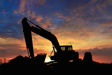 Canvas Print - silhouette excavators   in the construction site on the sunset background.