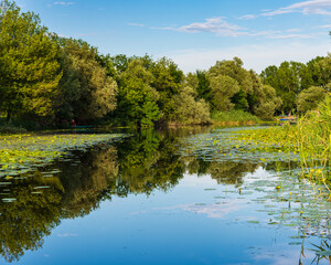 beautiful landscape on the moraca river with reflection in the water