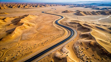 Wall Mural - Aerial view of a deserted road winding through barren desert landscape, remote, empty, road, aerial view, desert, landscape