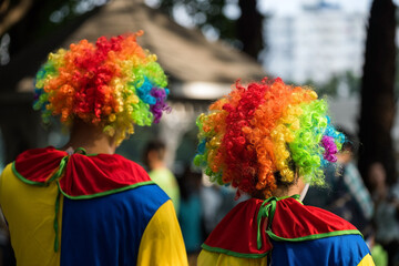 Rear of Jokers wearing colorful carnival wig, Fancy dress