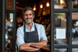 © alisaaa - New business Portrait of a business owner on the door of the restaurant