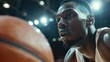 © Pemika - Focused basketball player dribbles under bright stadium lights