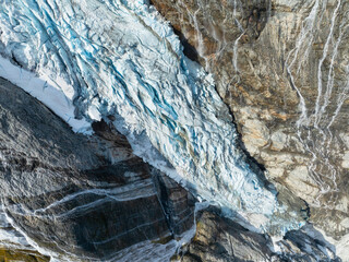 Wall Mural - an aerial view of a glacier and waterfall. landscape from a drone. view of the moraines. north. land