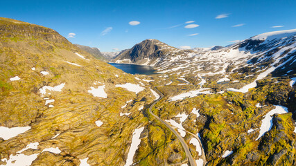 Wall Mural - nature in norway. panoramic aerial view of wild norway. road among the rocks and mountains. bright s
