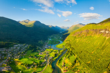Wall Mural - Stryn, Norway. Nature in fjords. Traveling through the Norwegian fjords. River in a mountain valley. Scandinavia. View of nature from the drone. Vacation and travel in summer Norway.