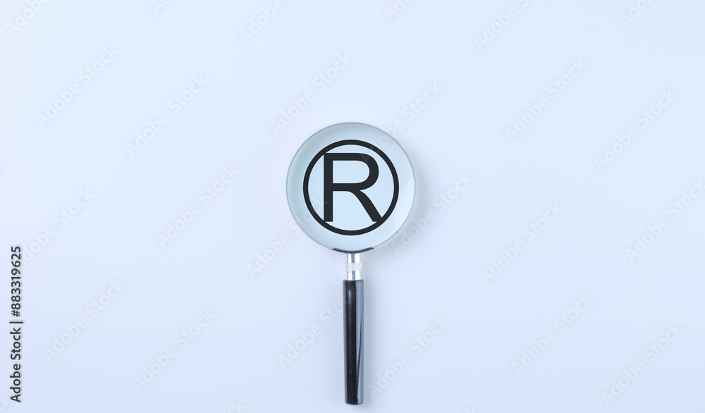 View of Register Trademark Copyright Symbol. A magnifying glass focuses on a ...