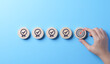 © Supatman - Standard Quality Control and Certification Concept. Hand places wooden block with target icon among blocks with check marks, standard quality control, certification, assurance for automation processes