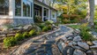 © Rasheed - The detailed, hand-laid stone walkway leading to a Suburban Cape Cod home, complementing its rustic charm