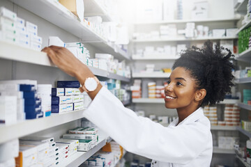 Canvas Print - Pharmacy, boxes and African woman at shelf to check medical info, inventory or quality assurance. Prescription medicine, pills and pharmacist in store with smile, healthcare and pharmaceutical drugs