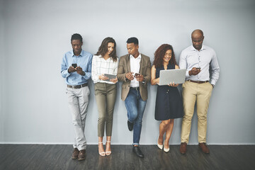 Leinwandbilder - Technology, online and line of business people on wall background in office for contact us, hiring and recruitment. Diversity, queue and men and women on tablet, laptop and phone for networking