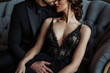 © Martinesku - Passionate couple in elegant evening dresses. Stylish and attractive in love couple. Luxurious male black suit costume. Girl in elegant evening black dress