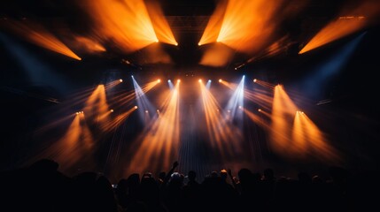 Wall Mural - Silhouettes of a crowd at a concert with dramatic stage lighting creating an electrifying atmosphere.