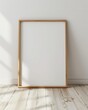 © Frame Mockup - light wood tan minimal THIN portrait frame that is 11x17 in size, with a blank picture on white EMPTY background IN A ROOM,