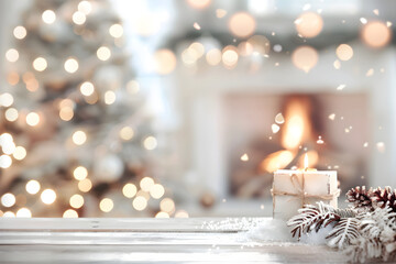 presents in snow on white table. white minimalistic scandi style new year interior. blurred living r