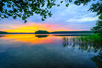 Wall Mural - colorful summer sunrise over the lake