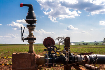 Wall Mural - valve and equipment of a vinasse irrigation system in a sugar cane field in Brazil